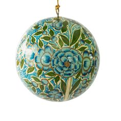 a blue and green ornament hanging from a rope