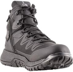 a pair of gray hiking boots with zippers on the side and black outstep