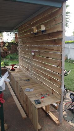 a bench made out of pallets and wood