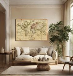 a living room filled with furniture and a large map hanging on the wall above it