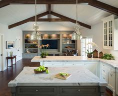 a large kitchen with an island in the middle