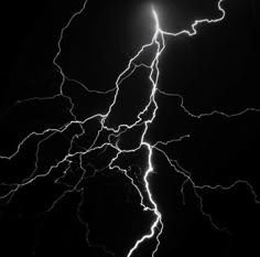 a black and white photo of lightning in the sky