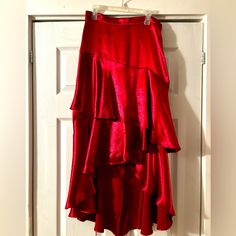 Red Silk Tiered Skirt, Fits Beautifully. Nwt. Waist - 28” Length - 24.5” (Front) 36” (Back) Chic Red Maxi Skirt For Night Out, Red Asymmetrical Lined Maxi Skirt, Red Asymmetrical Maxi Skirt With Lining, Red Maxi Skirt For Night Out, Red Asymmetrical Relaxed Skirt, Red Asymmetrical Relaxed Fit Skirt, Red Asymmetrical Flowy Skirt, Red Midi Skirt For Night Out, Fitted Red Maxi Skirt For Night Out