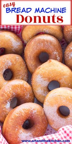 a pile of doughnuts sitting on top of a red and white checkered table cloth