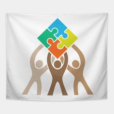 four people holding up puzzle pieces in the air