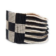 Check it out! Our new hand-beaded stretch bracelet is taking the internet by storm. With its 'business in the front, party in the back' design, this checkered patterned beauty is ready to catch compliments from every angle. Style tip: We're waving the checkered flag because this black and white neutral bracelet is a winner. Don't forget to complete the look with our Allison checkered earrings, too. DETAILS 7" L Seam to seam x 1.63" W Handmade by skilled artisans in India Hypoallergenic nickel + Checkered Earrings, Neutral Bracelet, Neutral Bracelets, Beaded Cuff Bracelet, Checkered Flag, Human Hand, Beaded Cuff, Bracelet Black, Gift Boutique