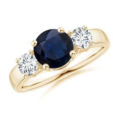 a three stone sapphire and diamond ring in yellow gold