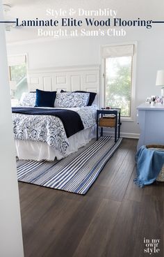 a bedroom with hardwood floors and white walls is featured in this article about how to clean your laminate wood flooring