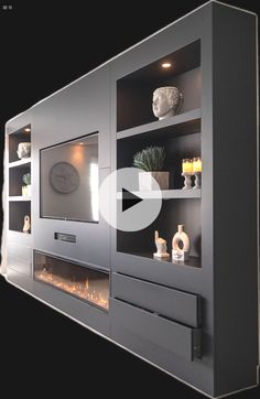 an entertainment center with built - in fireplaces and shelves