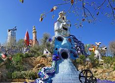 an elaborately designed sculpture in the shape of a horse on top of a hill