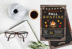 an open book, glasses and cup of coffee on top of a table