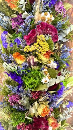 a bunch of flowers that are sitting on a table