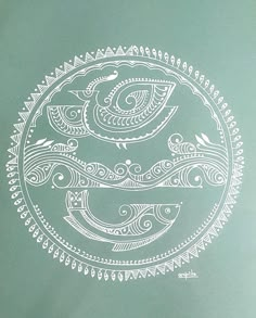 a white drawing on green paper with an eye in the center