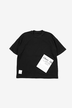 a black t - shirt with a tag on it