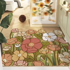 a rug with flowers on it in a room