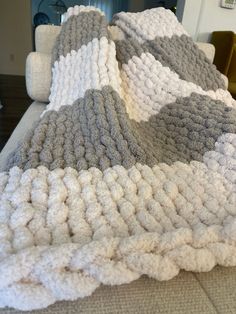 a blanket that is on top of a couch