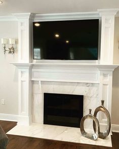 a fireplace with a flat screen tv above it