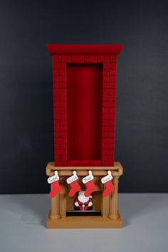 a red brick fireplace with stockings hanging from it