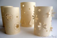 three paper cups with gold stars on them