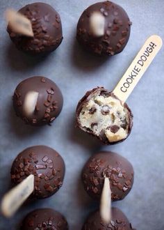 chocolate cookie dough bites with a spoon in it on a blue tablecloth next to an instagram post