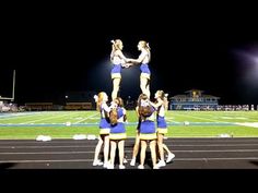 the cheerleaders are doing stunts on the track