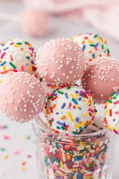 sprinkle covered donuts in a glass cup