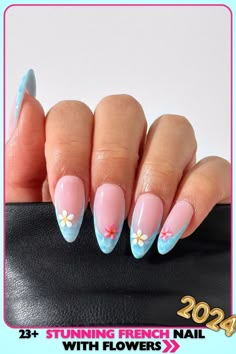 Stunning almond-shaped French nails with blue tips and colorful flower accents. Medium length, glossy gel finish. Ideal for making a statement. These French nails with flowers offer a fresh and fun look. French Nails With Blue, Nails With Blue Tips, French Nails With Flowers, Nails With Blue, Nails With Flowers, Blue Tips, Flower Nail Designs, French Nail Designs