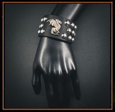 The "Dragons Lair" cuff looks so stunning. ✨ Adjustable 8" to 9" inches. ✨ 1-1/2 inches wide ✨ Steel snaps ✨ Made with heavy 7-8 oz leather ✨ SHIPPING AND PROCESSING✨ ✨NOT RESPONSIBLE FOR DELAYS IN SHIPPING, DAMAGED OR MISSING PACKAGES AFTER BEING SHIPPED. Dragons Lair, Black Cuff Bracelet, Silver Dragon, Studded Leather, Leather Silver, Real Leather, Cuff Bracelet, Rocker, Favorite Jewelry