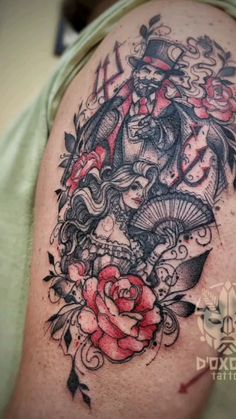 a man with a tattoo on his arm holding a rose and an old fashioned clock