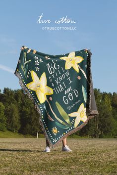 a woman holding up a blanket that says, i know what i am going to do