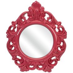 a red mirror sitting on top of a white wall