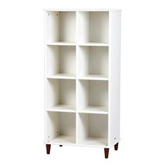 a white bookcase with four shelves on each side