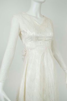 a white dress on a mannequin head