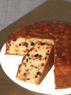 a cake on a plate with one slice cut out