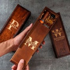 two wooden boxes with cigars in them