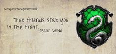 a green and black dragon with the words true friends stop you in the front - oscar wilde