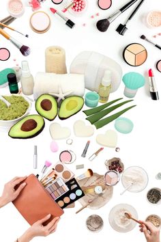 an assortment of cosmetics and makeup products on a white background with hands holding a piece of paper