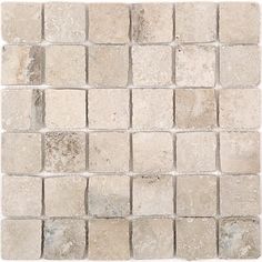 a white and gray tile wall with small squares on the bottom, in different sizes