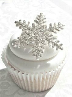 there is a cupcake with a snowflake on top