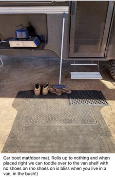 a pair of shoes sitting on top of a metal grate next to a drain