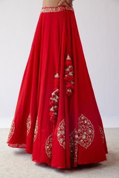 Red lehenga with floral motifs in dori and sequin embroidery. Paired with sleeveless blouse and embroidered sheer dupatta.
Component: 3
Pattern: Embroidered
Type Of Work: Sequins,Dori
Neckline: Plunge V Neck
Sleeve Type: Sleeveless
Fabric: Gajji Silk, Cotton Silk Satin And Silk Organza
Color: Red
Other Details: 
Organza dupatta
Sequin and resham work
Tassel detail
Occasion: Wedding - Aza Fashions Red Floor-length Choli With Gota Work, Floor-length Red Choli With Gota Work, Red Embellished Georgette Sharara, Red Floor-length Lehenga With Gota Work, Red Embellished Sharara For Navratri, Red Embellished Dress For Navratri, Red Sleeveless Lehenga For Weddings, Sleeveless Red Lehenga For Wedding, Red Dresses For Reception And Navratri