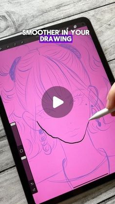 someone is drawing on an ipad with a marker