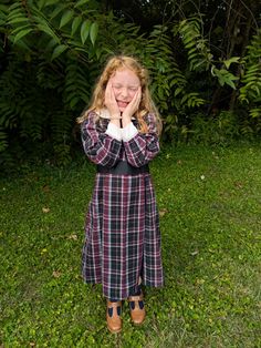 This black plaid dress is great for little girls at play or those who want to dress up. this is made from a flannel fabric so it will stay nice and warm on these colder days. There is a Peter Pan collar and a tie in the back for all those little girls who grew up so fast. This is a vintage inspired dress made off of a vintage pattern. There is a zipper in the back for the closure. Shipping is included in the price This is a size 6 Waist 30" Collar 15" around  Growth pleat 1" Cute Plaid Dresses For School, Fitted Plaid School Dress, Fitted Plaid Dress For School, Fitted Plaid Preppy Dress For Fall, Fitted Plaid Dress For Fall In Preppy Style, Fitted Plaid Dress For Fall, Preppy Style, Black School Dresses For Fall, Black Fall Dresses For School, Black Dresses For School In Fall