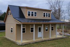 a two story house with a metal roof