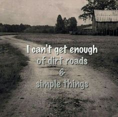 a dirt road with the words i can't get enough of dirt roads and simple things