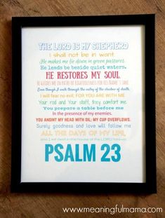 the lord is my shepherd print in a frame on a wooden table with a black border