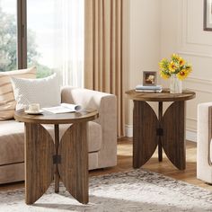 a living room filled with furniture and a table in front of a window on top of a rug