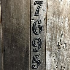 a wooden door with numbers painted on it