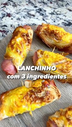 ham and cheese appetizers with toothpicks on a cutting board