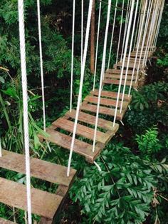 the rope bridge is made from wooden planks